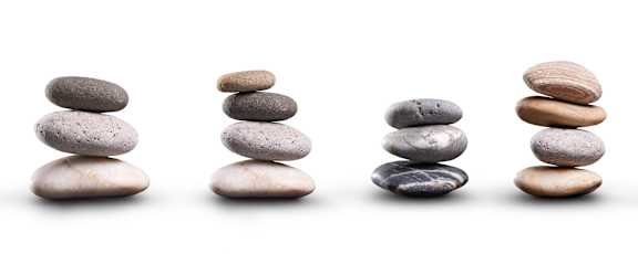 Four stacks of stones decreasing in height from left to right.