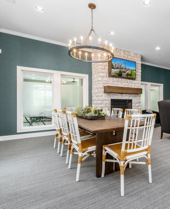 a kitchen and dining room with a table and chairs