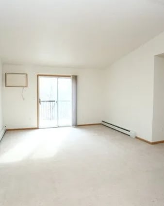 A room with a window and a door.