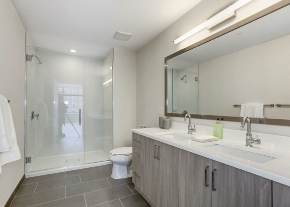 Bathroom with a shower and a toilet and a sink at The Brody, Bethesda, Maryland