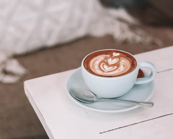 a cup of coffee on a table