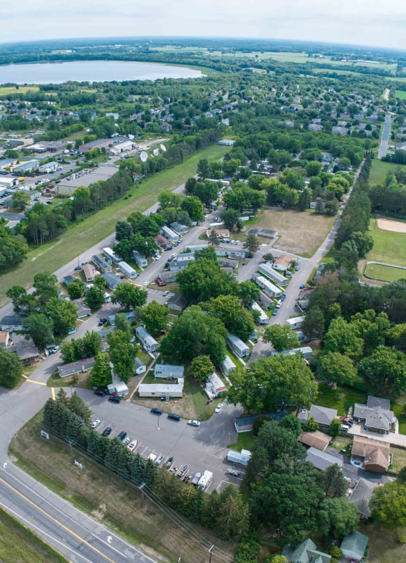 an aerial view of an rv park with houses and trees