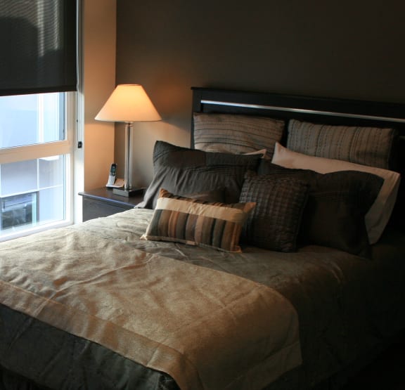a bedroom with a large bed and a window at Blue Koi by Lotus in Sugarhouse, Salt Lake City, UT
