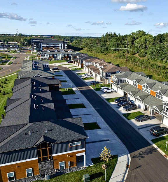 A large building with a parking lot in front of it.