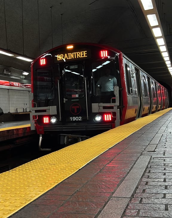 a subway train pulling into a subway station