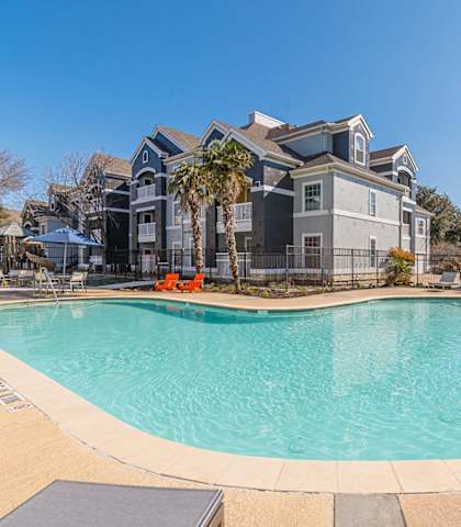 the preserve at ballantyne commons pool with apartment buildings in the background at Capitol Crossing, Austin, 78744
