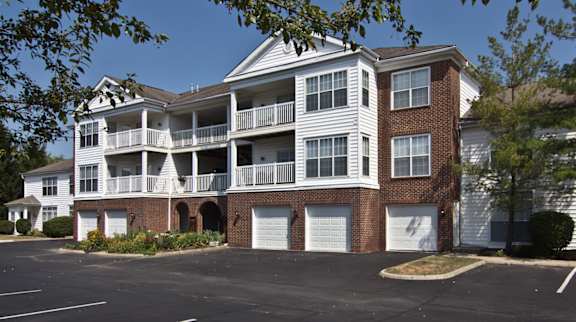 A parking lot in front of a two story apartment building at The Orchard, Dublin, Ohio