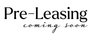 A sign that says "Pre-Leasing coming soon" in black text on a white background.