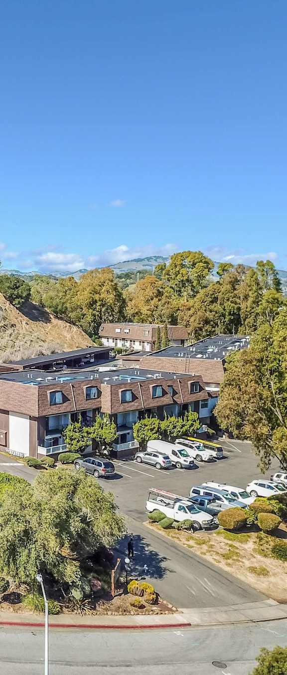 aerial view of apartment buildings and hillside at Posada East Apartments, California, 94949