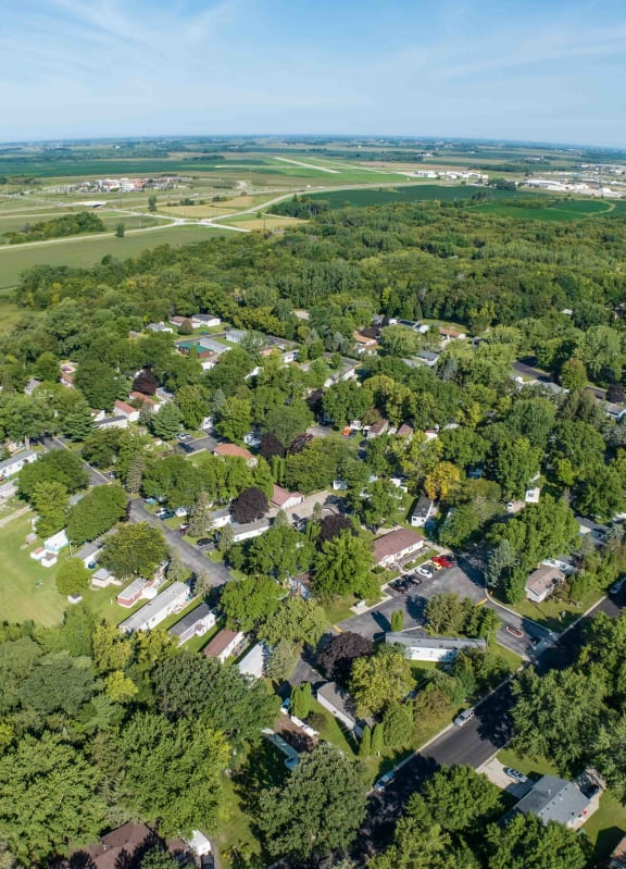 an aerial view of a neighborhood with houses and trees