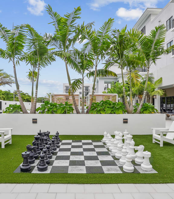 a giant chess board in the middle of a lawn at Westgate on University in Lauderhill, FL