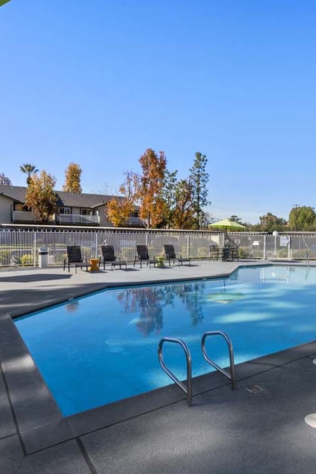 a swimming pool in front of an apartment building at Aspire Redlands, California, 92374