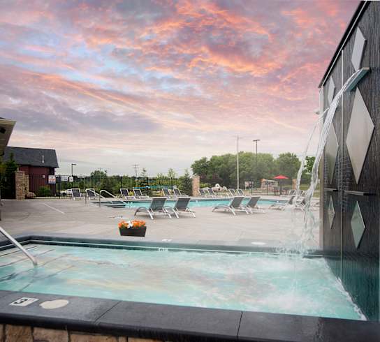 Pool and hot tub at Quarry Apartments and Townhomes in DeWitt, Michigan