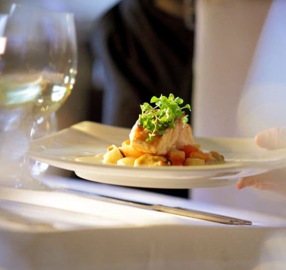 a plate of food on a table at a restaurant at Trophy Club at Bellgrade, Midlothian, VA, 23113