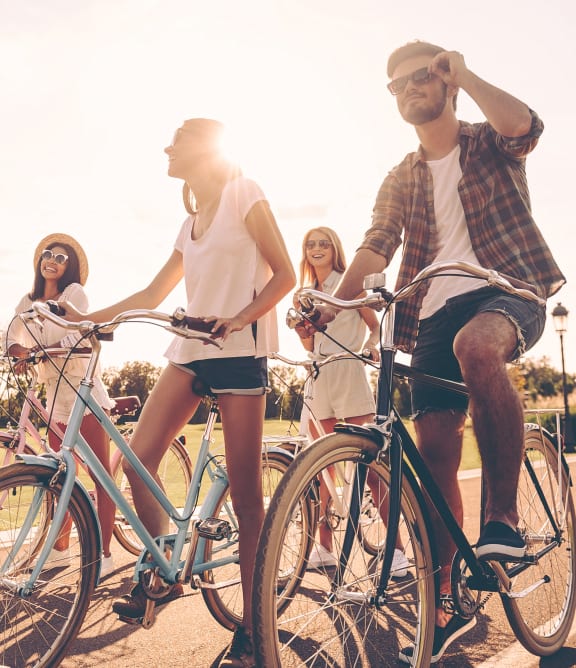 Omaha, NE Evergreen Terrace Apartments | Group of friends riding bikes