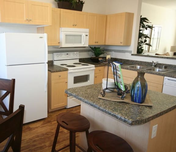 Apartment kitchen with appliances and island, Symphony Apartments