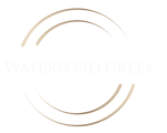 the logo for waterford creek with two circles around it