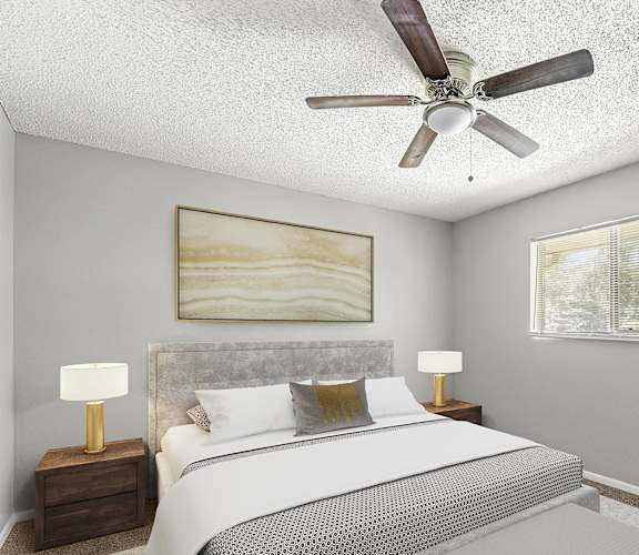a bedroom with a bed and a ceiling fan at Northgate Townhomes in Tucker, GA 30084