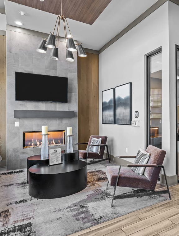 a living room with a fireplace and a table at Alton Jefferson Park, Denver, 80211