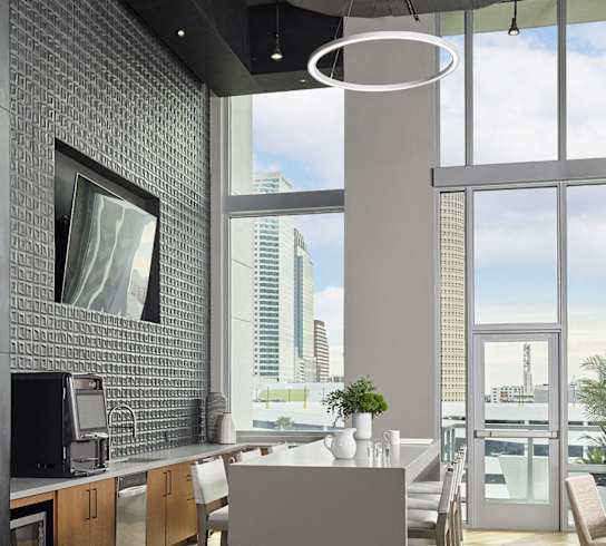 A modern kitchen with a view of the city.