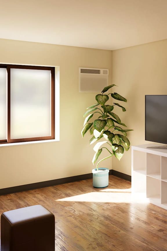 A living room with a television, a couch, a table, and a plant.