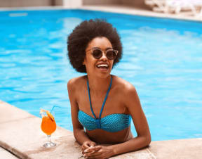 Woman in Swimming Pool Smiling