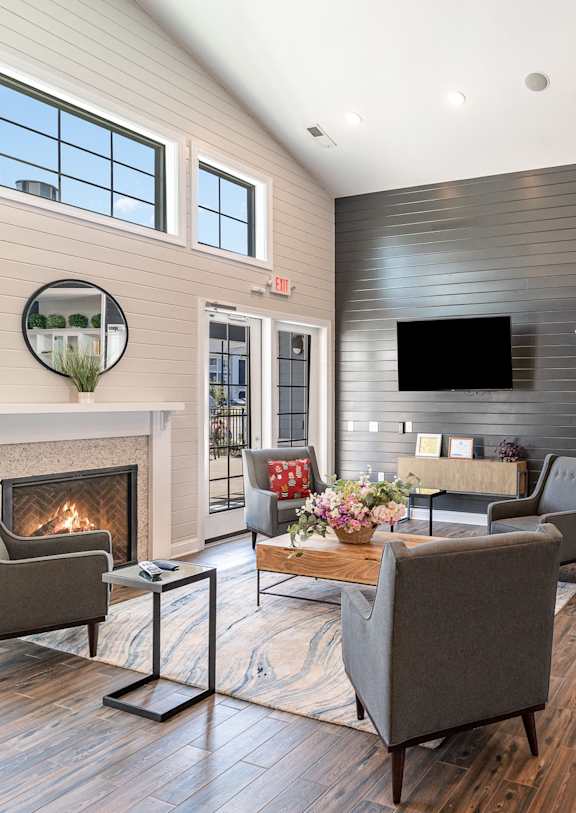 a living room with furniture and a fireplace