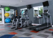 Thumbnail 14 of 23 - Fifteen 50 apartments near Las Vegas strip on site gym with treadmills, ellipticals, yoga mats, exercise balls, and dumbbell weights.