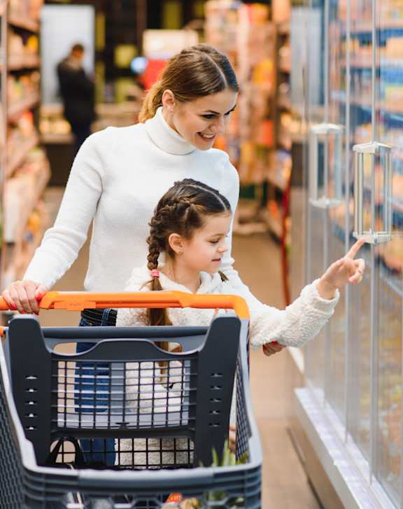 A woman and a child are shopping in a grocery store at 46Eleven Apartments, Dallas, TX, 75228