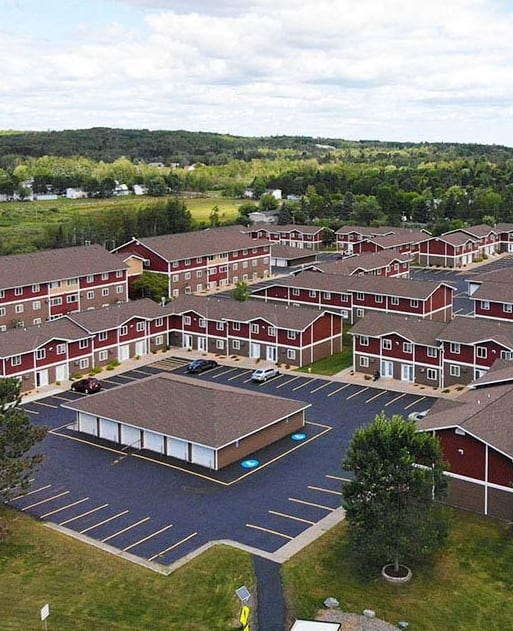 an aerial view of a building complex with a road