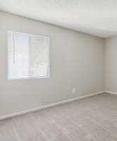 a bedroom with a bed and pillows