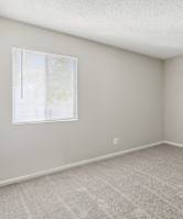 a bedroom with a bed and pillows