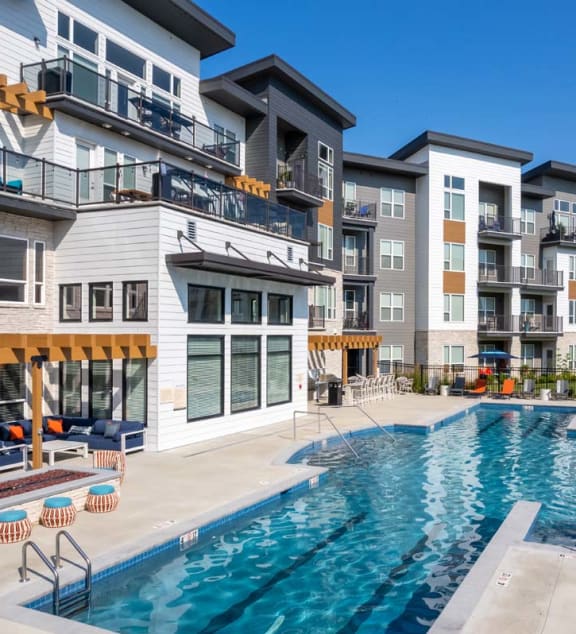 an apartment building with a swimming pool