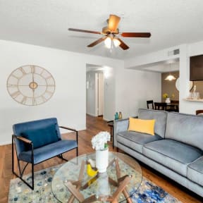 a living room with a couch and a glass table at Glen Brae, Glendale, AZ, 85301