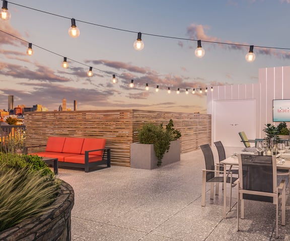 a rendering of a rooftop patio with a sunset in the background