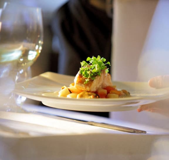 a plate of food on a table at a restaurant at Brickshire Apartments, Merrillville, Indiana