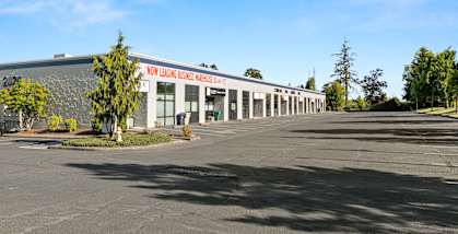 Cornelius Pass BP exterior building storefronts and parking lot
