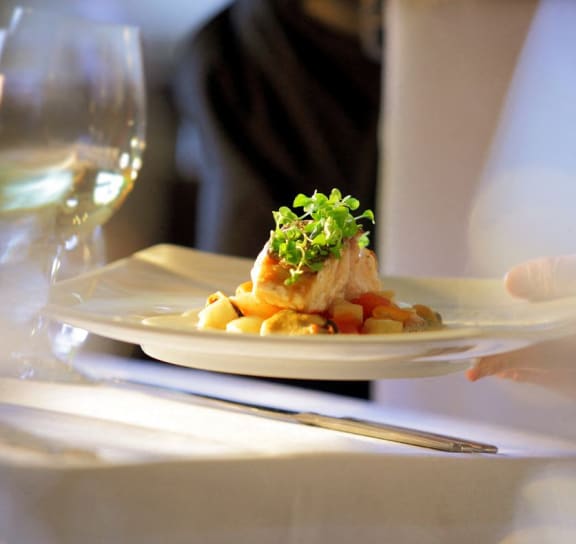 a plate of food on a table at Bella Vista Apartments in Fishers, IN 46038