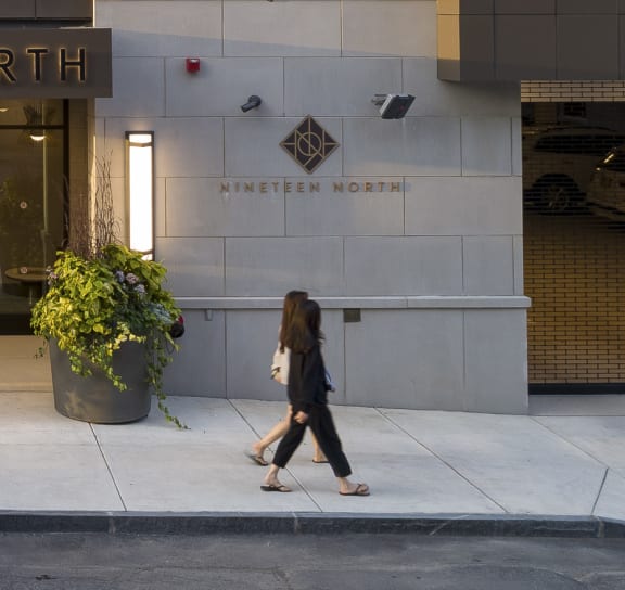 a car is parked in front of the entrance to the ninnien north building  at Nineteen North, Buffalo, New York