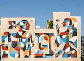 Thumbnail 74 of 74 - A large, colorful mural on a building in a city.