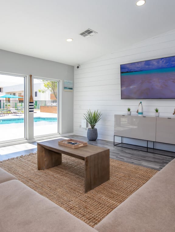 a large living room with a kitchen and a dining room