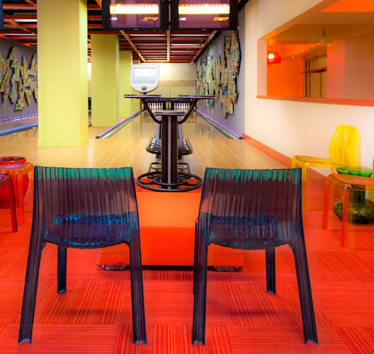 a dining room with colorful chairs and a table