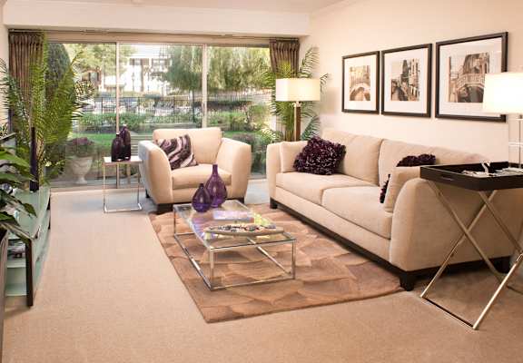 a living room with white furniture and a large window at Versailles on the Lakes Oakbrook*, Oakbrook Terrace, 60181