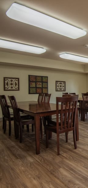 a common room with a table and chairs and a couch