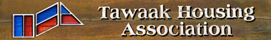 Tawaak Housing Association logo on a wooden background.