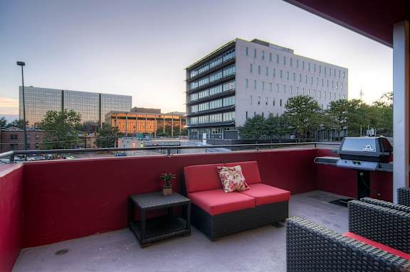 Our Apartment Common Area Patio with BBQ Grill at Sleek Lofts Apartments in Denver, Colorado