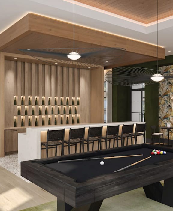 A pool table is in the middle of a room with a green wall and a sign that says "Clubroom Game Room".
