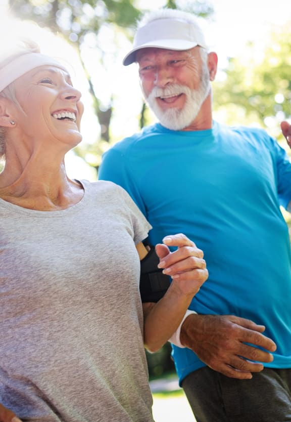 This is a photo of an older active couple running.