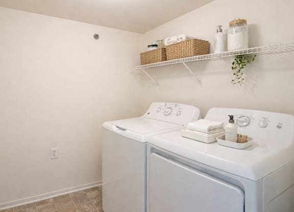 A laundry room with a washer and dryer.
