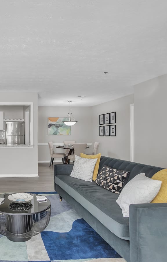 a living room with a fireplace and a couch